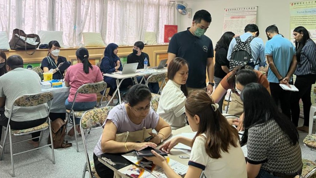 Free Health Talk & Assessment — health checks and registration in progress