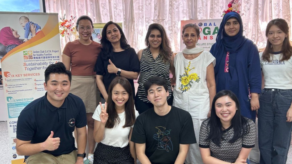 Free Health Talk & Assessment — group photo with Jockey Club S.A.T.H. Project banner