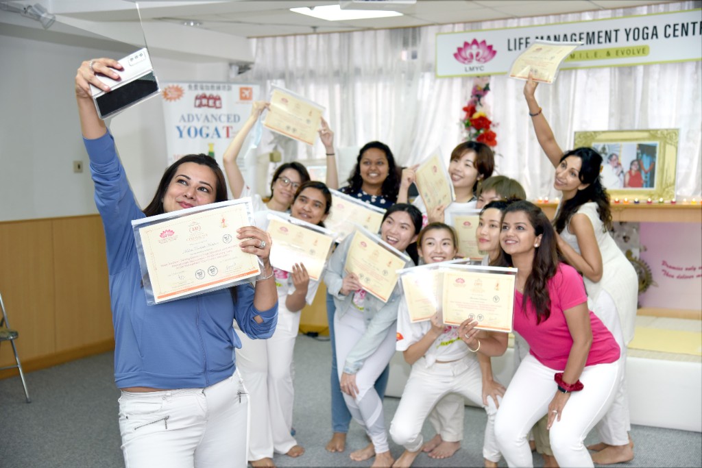 RYT 200 graduates with certificates at LMYC