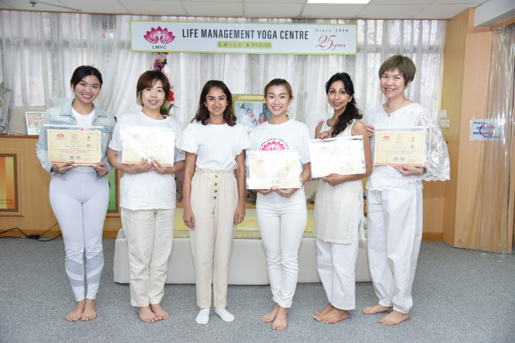 RYT 500 graduates with certificates at LMYC
